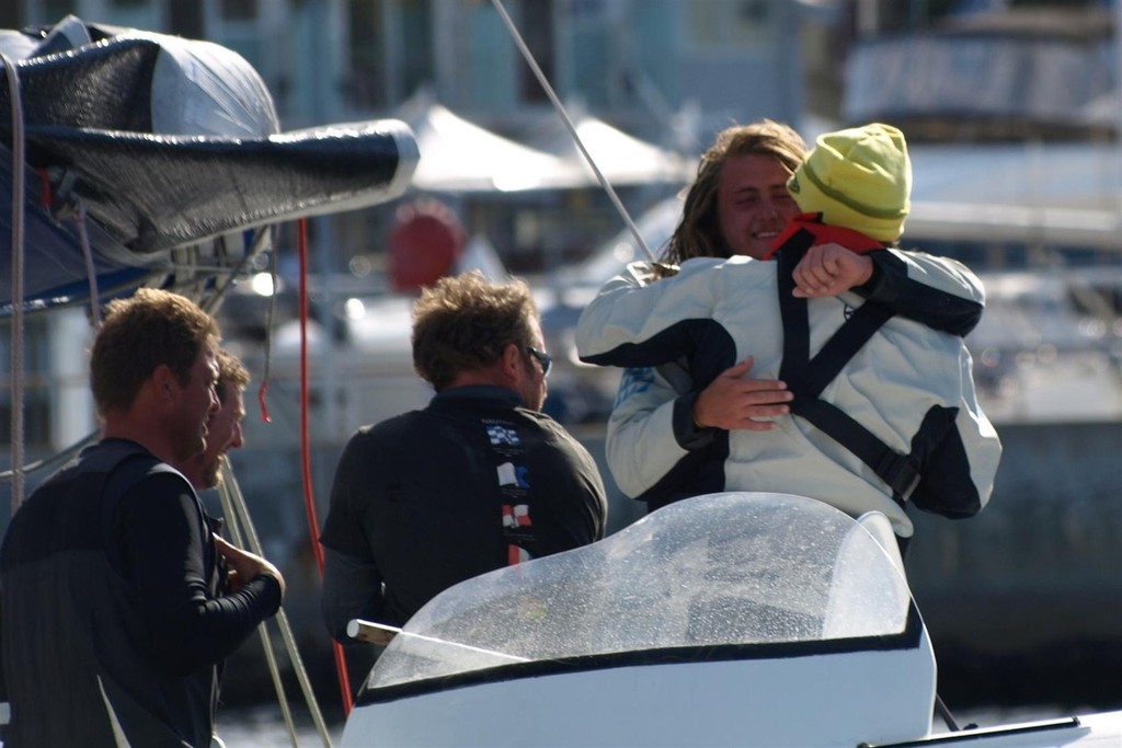 Peter & Sean Langman embrace - New Sydney Hobart passage record holder Team Australia - blasts home © Jane Austin